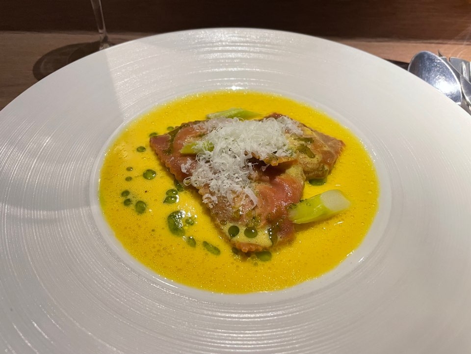 Onion raviolone filled with spring onion and white miso, wrapped in beet-stained dough and topped with dill oil and Pecorino (Hong Yoo/ The Korea Herald)