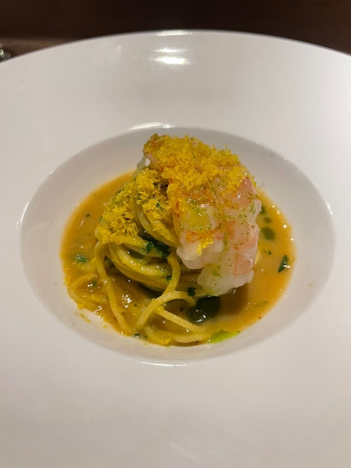 Tajarin with sweet shrimp and bisque sauce, made with flour and egg pasta, tossed in a rich bisque and topped with bottarga (Hong Yoo/ The Korea Herald)