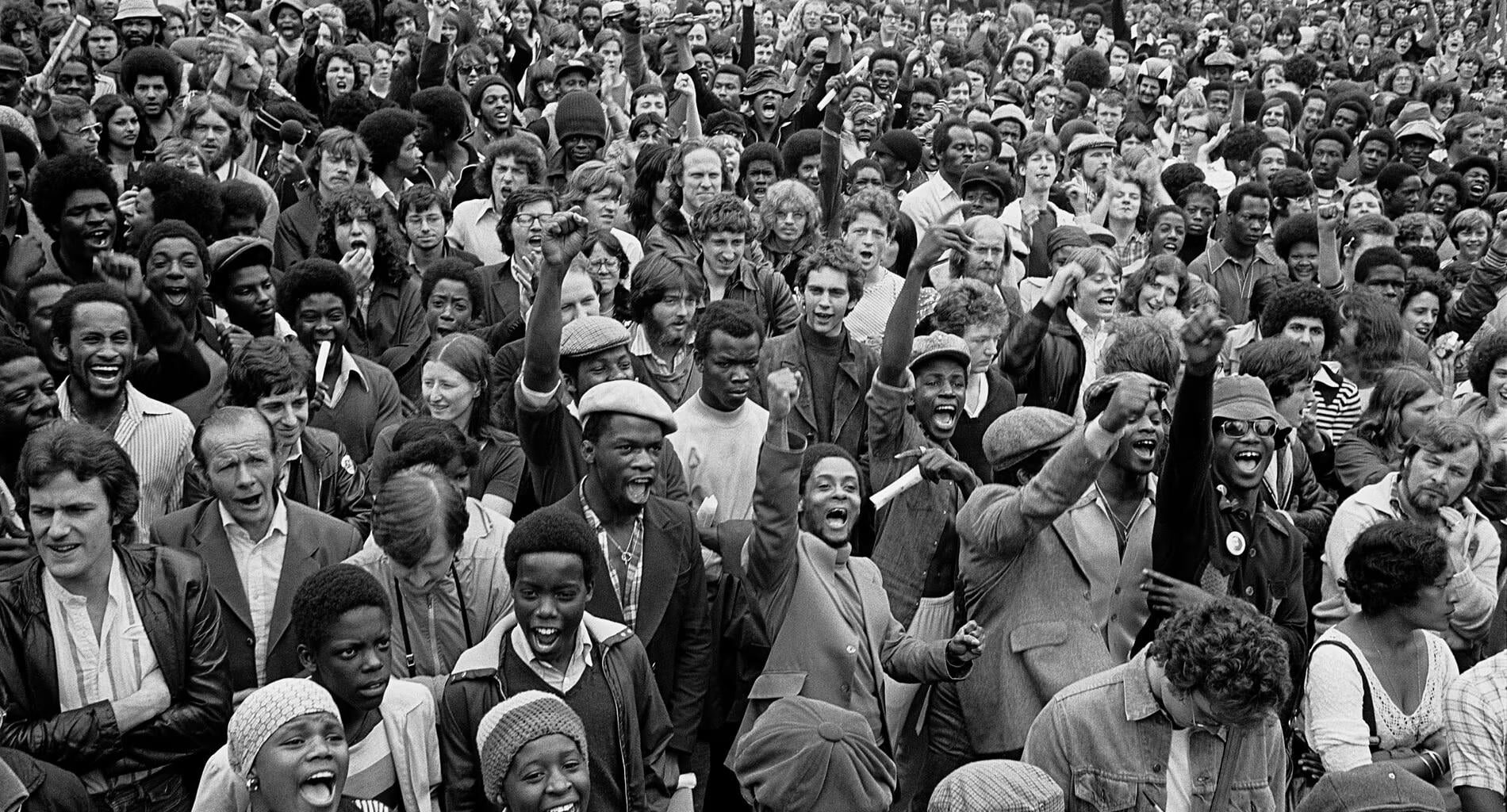 Anti-racists gather to block the route of a National Front demonstration, New Cross Road, August (1977)