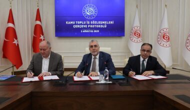 Labor Minister Vedat Isikhan (center) poses with union representatives after signing the 2025–2026 Public Collective Labor Agreement Framework Protocol in Ankara, Türkiye, August 2, 2025. (AA Photo)