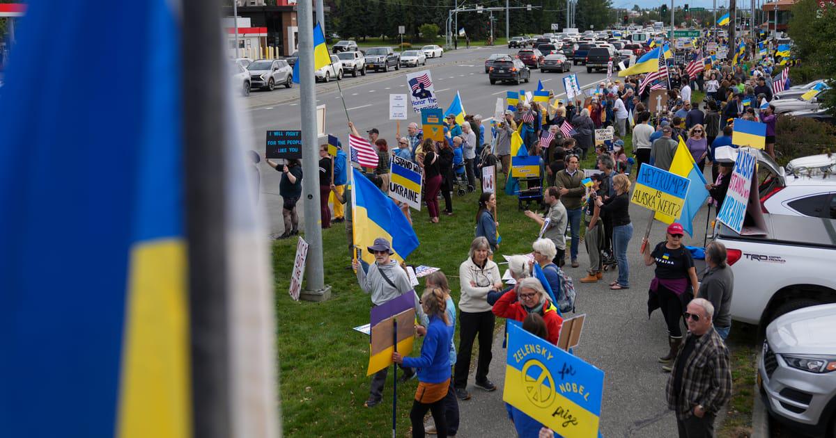 Alaskans greet Putin with Ukrainian flags, protest ‘war criminal hanging out here’