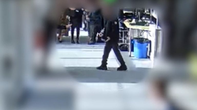The defendant holding a knife in the canteen
Pics: South Yorkshire Police/PA