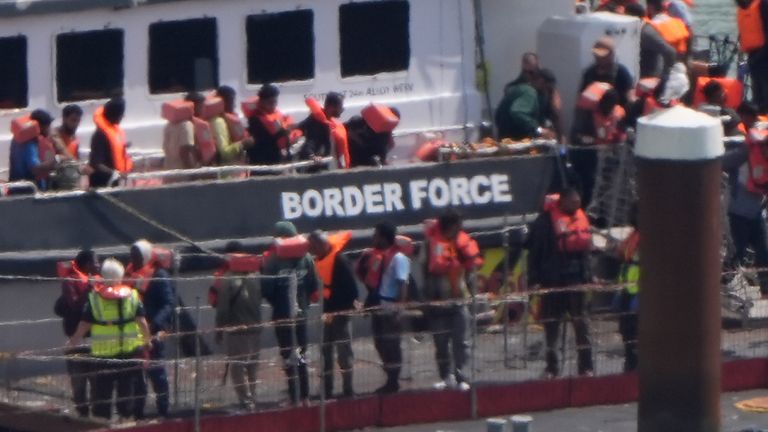Migrants are brought in to the Border Force compound in Dover, Kent, Pic: PA