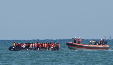 A boat intercepts migrants on a small boat in the Channel off Calais. File pic: PA