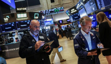 Traders work on the floor at the New York Stock Exchange (NYSE) in New York City, US, August 6, 2025.