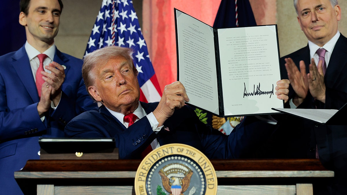 Trump holds up AI executive order