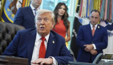 President Donald Trump speaks as he signs executive orders in the Oval Office of the White House, Monday, Aug. 25, 2025, in Washington. Standing with the President from left are, Secretary of Defense Pete Hegseth, Homeland Security Secretary Kristi Noem and Director of U.S. Federal Marshall Service Gadyaces Serralta. (AP Photo/Evan Vucci)