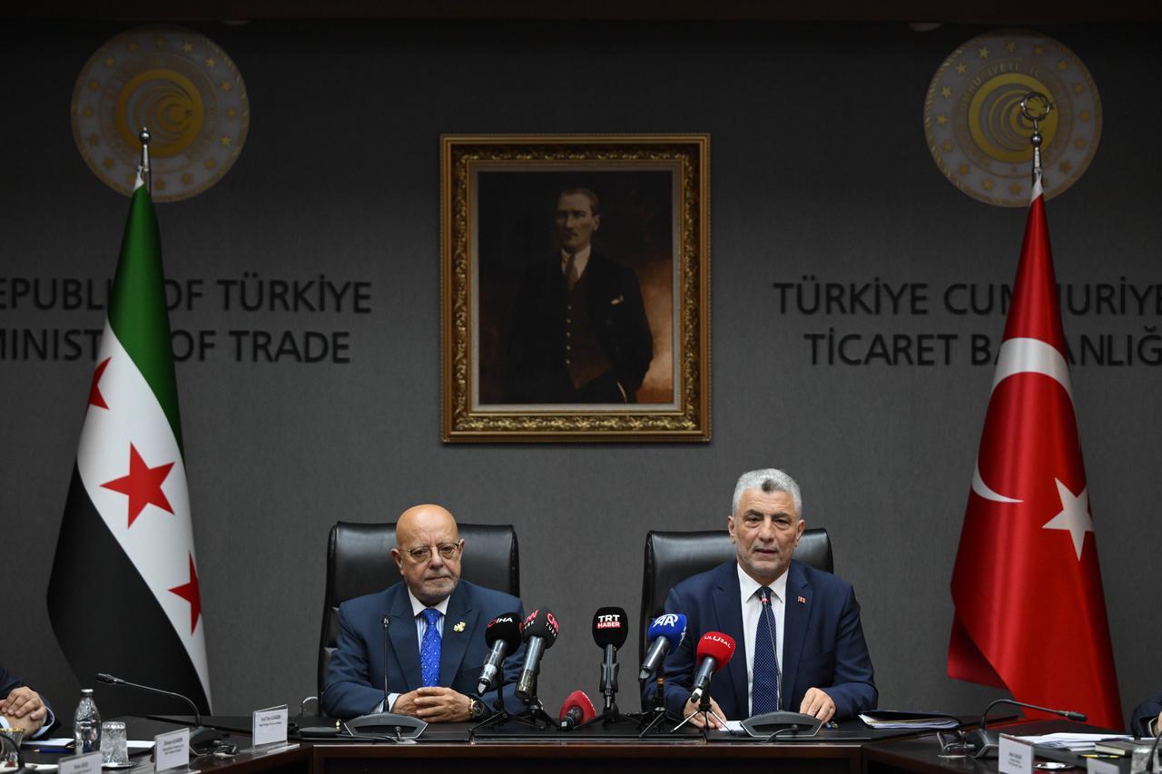 Turkish Trade Minister Omer Bolat and Syrian Minister of Economy and Industry Nidal Shaar attend the signing ceremony in Ankara, Türkiye on August 5, 2025. (AA Photo)