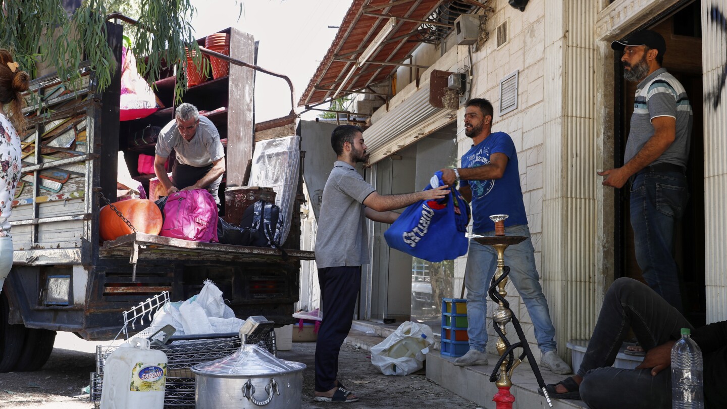 Alawite families flee Damascus suburb after eviction threats