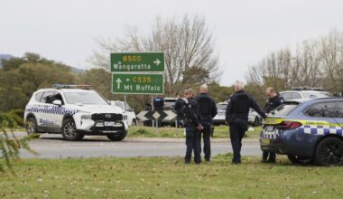 Australian police hunt for gunman who killed 2 officers and shot another in a rural town