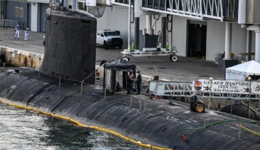 U.S. Navy personnel stand a top USS New Hampshire (SSN-778), a Virginia-class nuclear-powered attack submarine at Port Everglades in Fort Lauderdale, Florida, on April 29, 2025.
