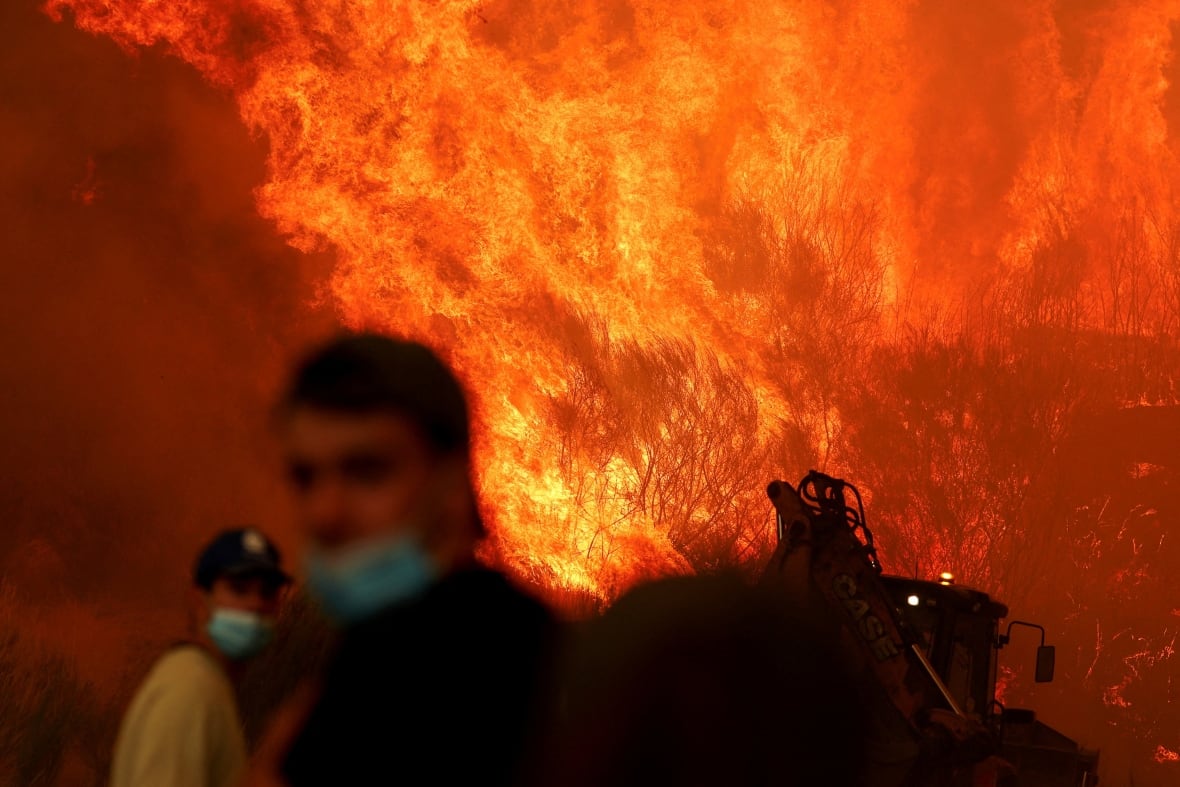 A wildfire is seen near Trancoso, Portugal, in August 2025.