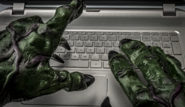 Monster hands typing on keyboard