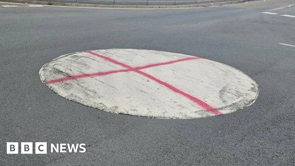 Police investigate England flag 'graffiti' on roundabout