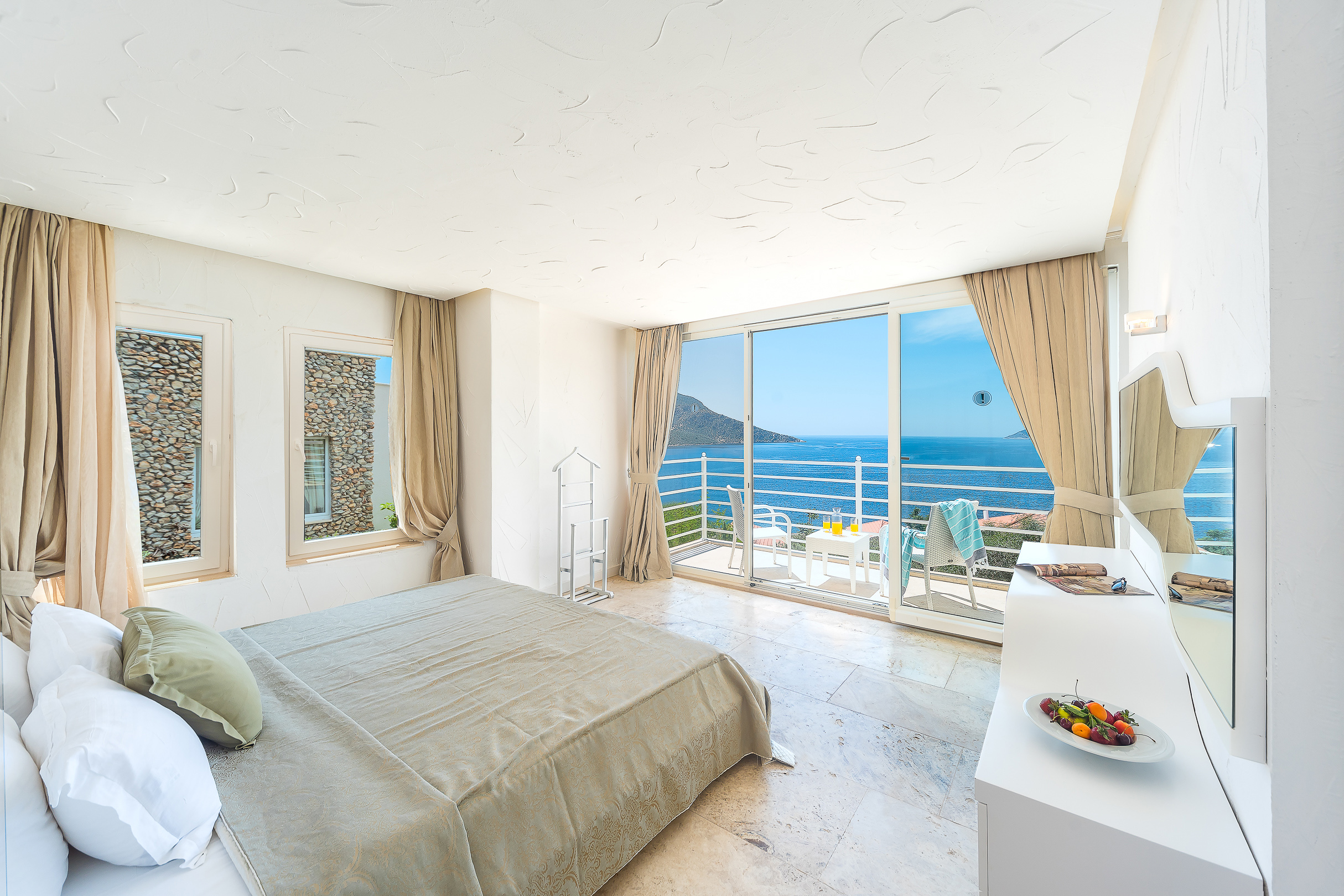 Looking out to the sea from inside a guest bedroom at Likya Pavilion in Kalkan, Turkey