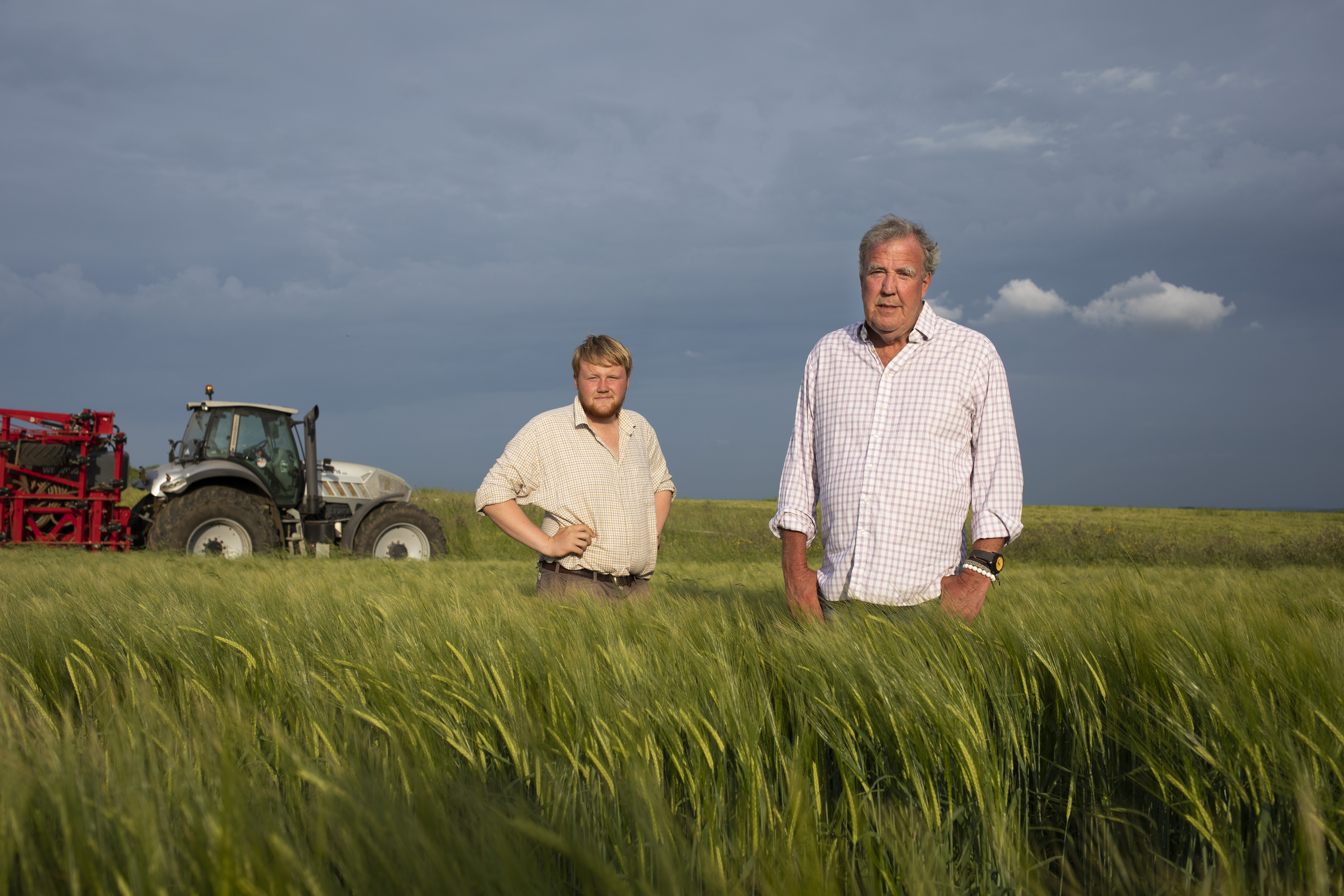 Jeremy Clarkson and Kaleb Cooper in a barley field.