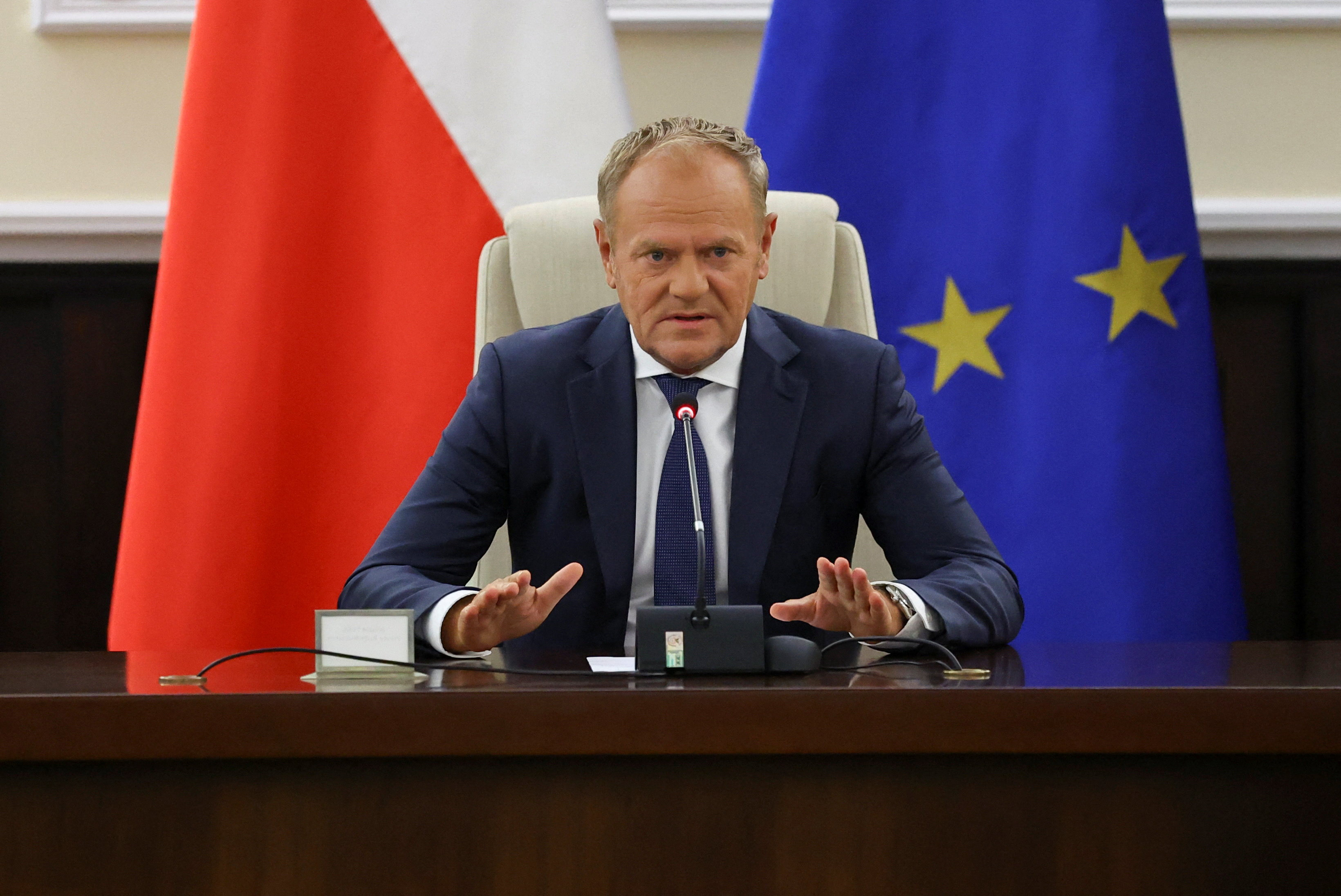 Donald Tusk addresses government officials at a meeting about the attack