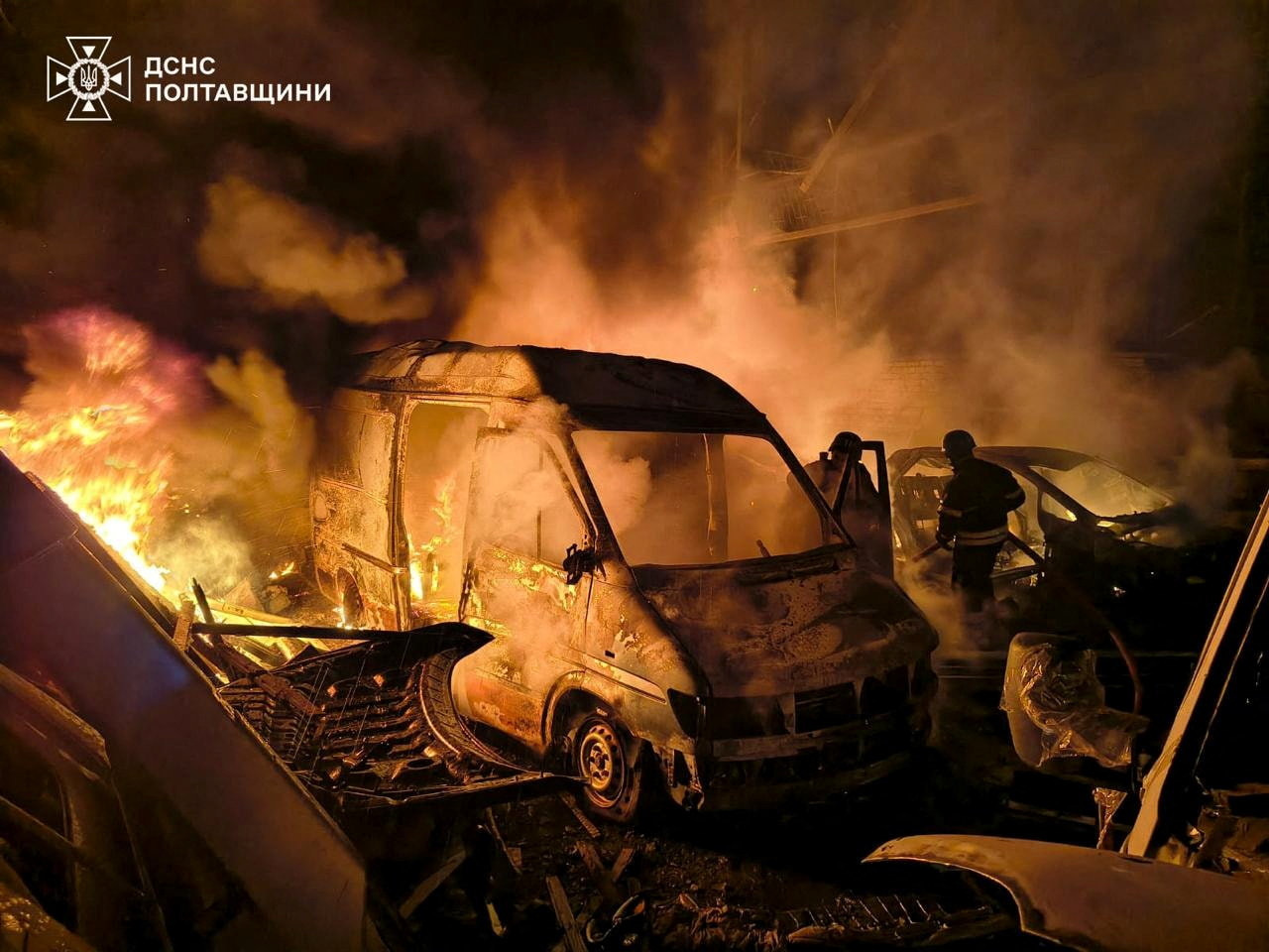 Firefighters at the site of a Russian strike in Kremenchuk in central Ukraine