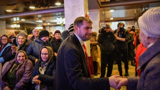Moldova's parliamentary candidate Ilan Shor, businessman, leader of his self-named party and the mayor of the town of Orhei, meets with supporters during a campaign event in the city of Comrat on February 15, 2019. - On the campaign trail, businessman Ilan Shor insists corruption is Moldova's most p