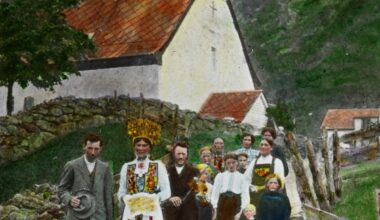 Wedding procession in Eidfjord church. Norway, 1900. Hand-colorized.
