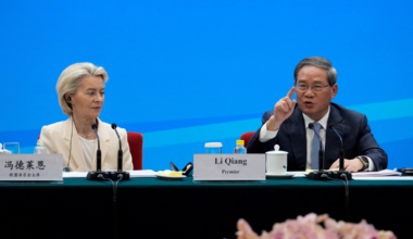 FILE PHOTO: Chinese Premier Li Qiang speaks as European Commission President Ursula von der Leyen looks on during the EU-China Business leaders symposium at the Great Hall of the People in Beijing, China, July 24, 2025. Mahesh Kumar A./Pool via REUTERS/File Photo