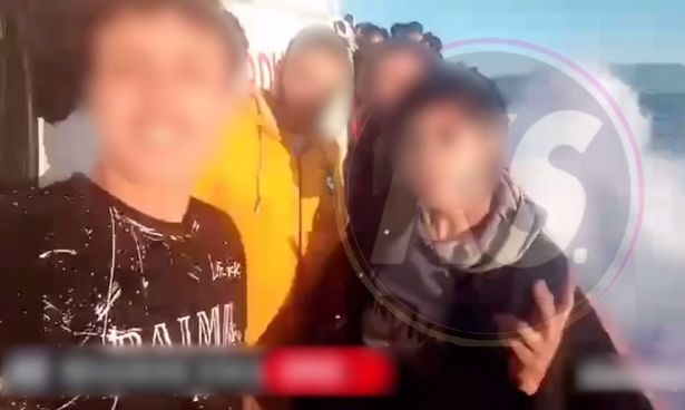 Migrants travelling on a boat