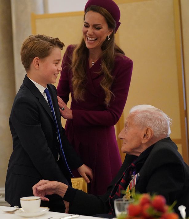Prince George of Wales and Catherine, Princess of Wales speak with Second World War veterans at a tea party in Buckingham Palace on May 5, 2025
