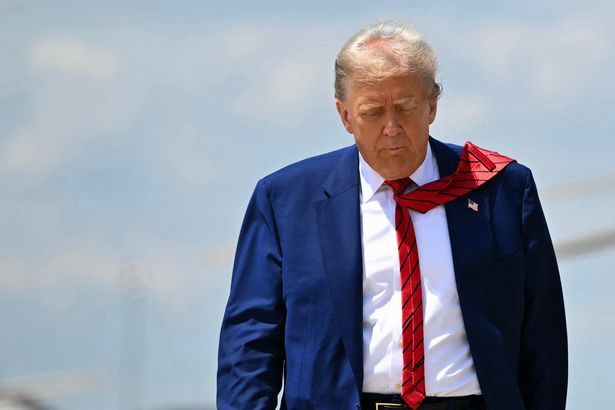 Mr Trump walks to board Air Force One before departing for his last UK state visit