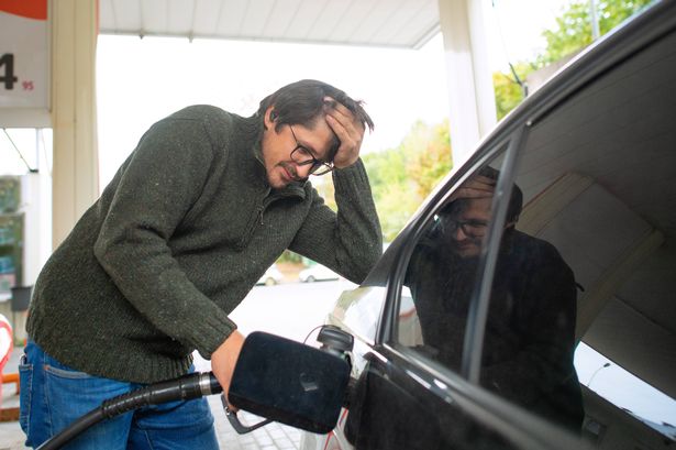 Man displeased and worried about fuel prices. Energy crisis concept,