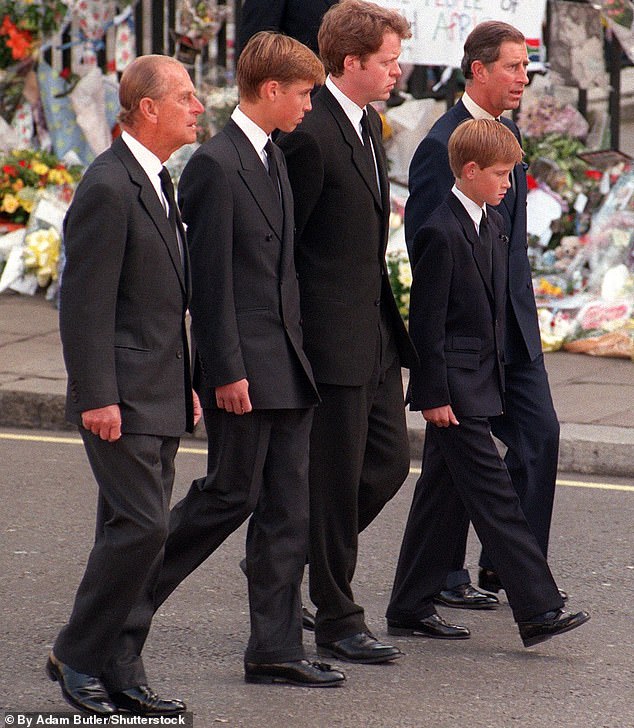 a young Prince William and Prince Harry joined by the now King Charles, the Earl of Spencer and Prince Philip as they walk behind the hearse carrying Princess Diana's funeral