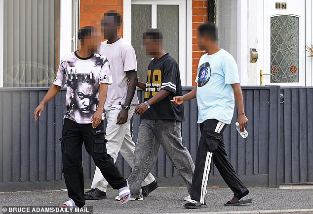 Somalian and Afghan men, some fresh off the Channel boats, are the new residents of three big Victorian houses in Skegness. Pictured: Somalian Men seen leaving 33 and 35, Grosvenor Road