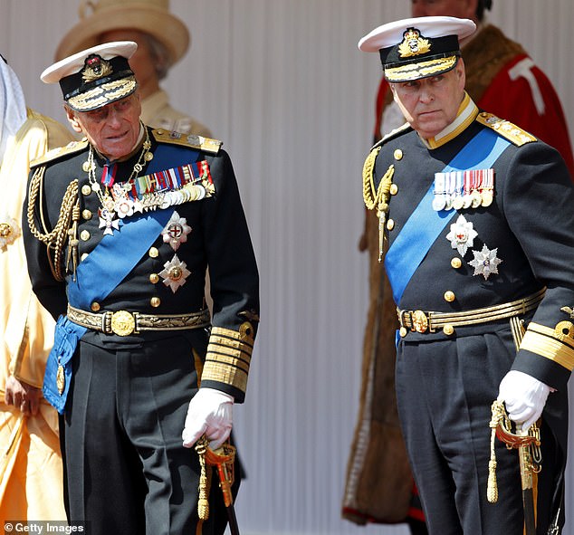 Prince Andrew and Prince Philip in 2013. Duke of Edinburgh 'banned' Fergie from all the royal residences after her notorious toe sucking scandal