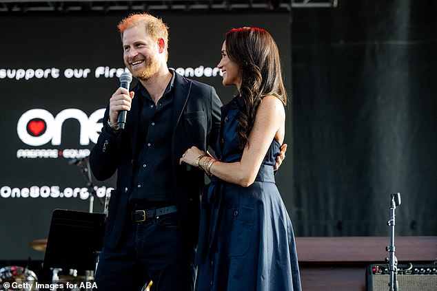 Meghan donned a sleeveless, dark navy dress as well as a pair of stylish pumps for the outdoor event - which helps raise funds for local fire, police and sheriff departments