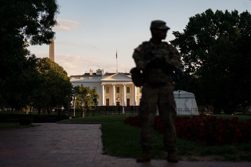 A member of the National Guard stands in Lafayette Park outside of the White House on August 25.