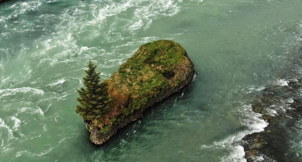 Jóruklettur rock lies just upstream from the Ölfusá bridge, and …