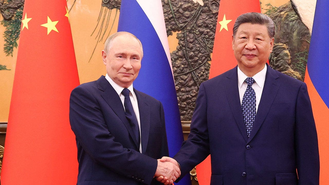 Trump accuses Putin, Xi and Kim of conspiring at Beijing military parade