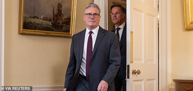 British Prime Minister Keir Starmer and NATO Secretary General Mark Rutte walk as they meet at 10 Downing Street, in London, Britain, September 9, 2025. Joshua Bratt/Pool via REUTERS