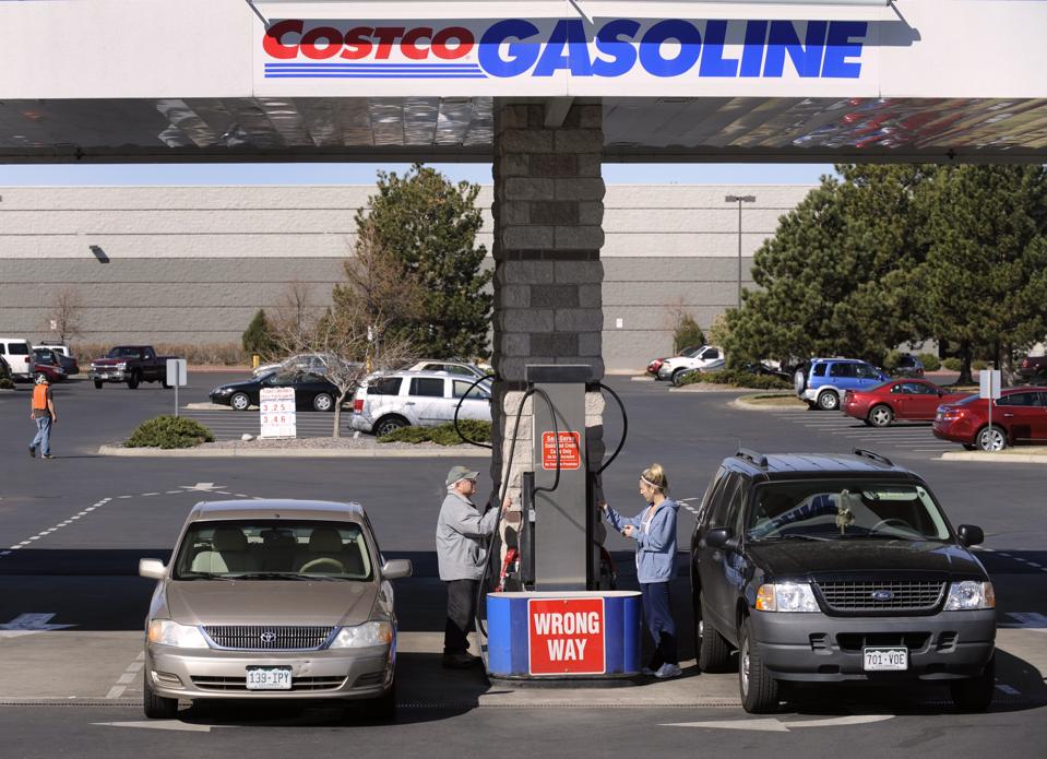 Customers pump gas at a COSTCO in Aurora, Colorado. The U.S. EIA says gasoline costs for consumers are the lowest levels since 2005. (Photo By Kathryn Scott Osler/The Denver Post via Getty Images)