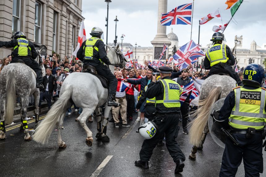 Police officers were “attacked with projectiles” and “assaulted” during the Unite The Kingdom rally.