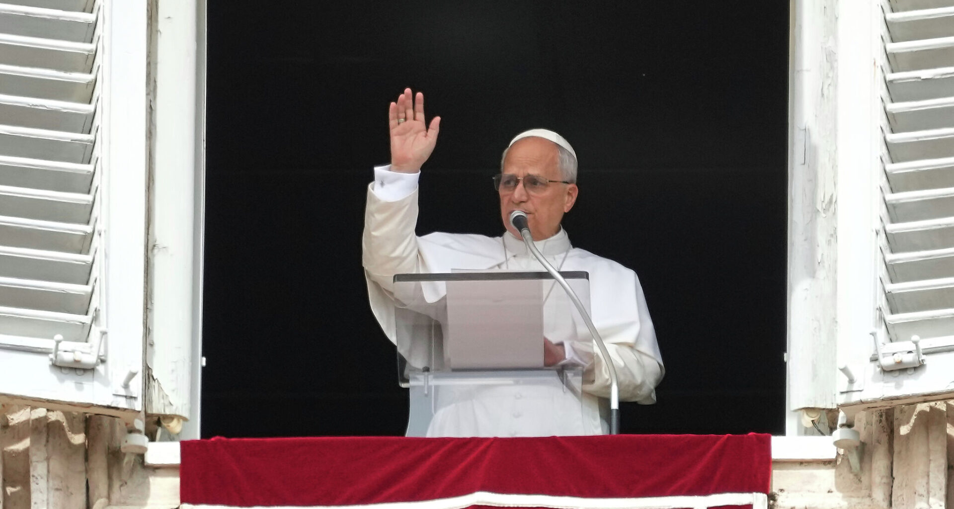 Pope Leo XIV appears Sunday at his studio's window to bless the faithful gathered in St. Peter's Square at the Vatican for the Angelus prayer.