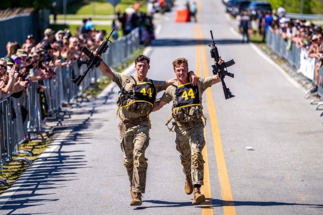 Two Soldier entering the finish line in the 41st Annual David E. Grange Jr. Best Ranger Competition at Fort Benning, GA, April 13, 2025. The Best Ranger Competition spans three days of continuous events, rigorously challenging Ranger qualified...