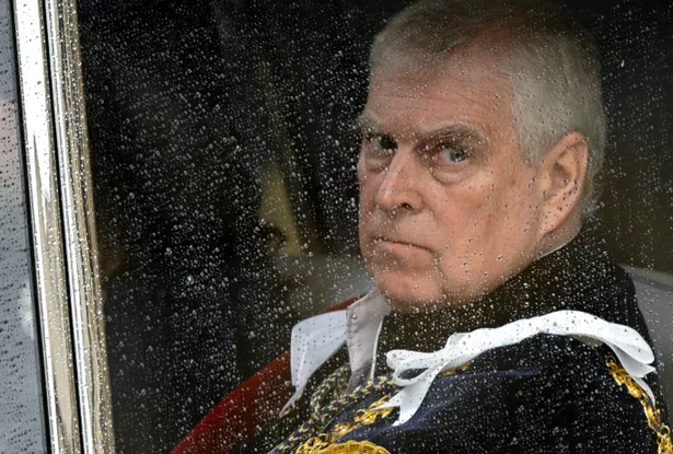 Prince Andrew through a car window 