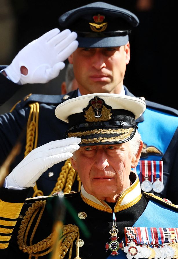 King Charles III and Prince William, Prince of Wales salute after the State Funeral of Queen Elizabeth II on September 19, 2022 