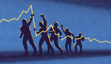 A line of silhouetted people holding up a yellow trend line