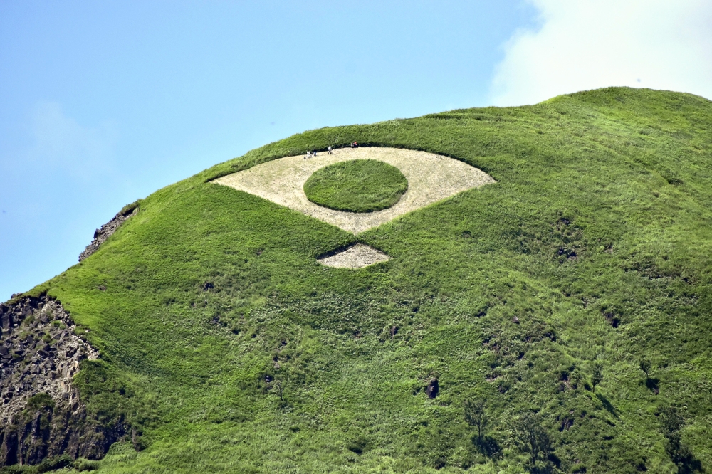Fan shape shaved on mountain slope in Japan to honor agricultural ritual