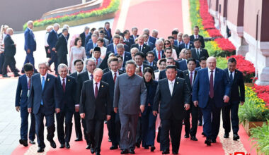 Chinese President Xi Jinping (center, front row) walks with Russian President Vladimir Putin (left, front row) and North Korean leader Kim Jong Un (right, front row) as they lead a group of other officials to attend the 80th Victory Day parade military parade in Beijing's Tiananmen Square on Sept. 3, 2025, in this picture released on Sept. 4 by the Korean Central News Agency (KCNA) of North Korea.