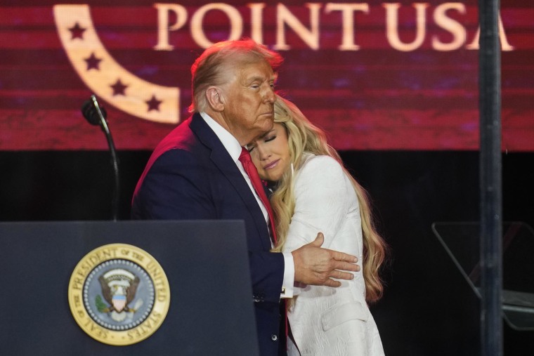 President Donald Trump embraces Erika Kirk at a memorial for conservative activist Charlie Kirk, Sunday, Sept. 21, 2025, at State Farm Stadium in Glendale, Ariz. 