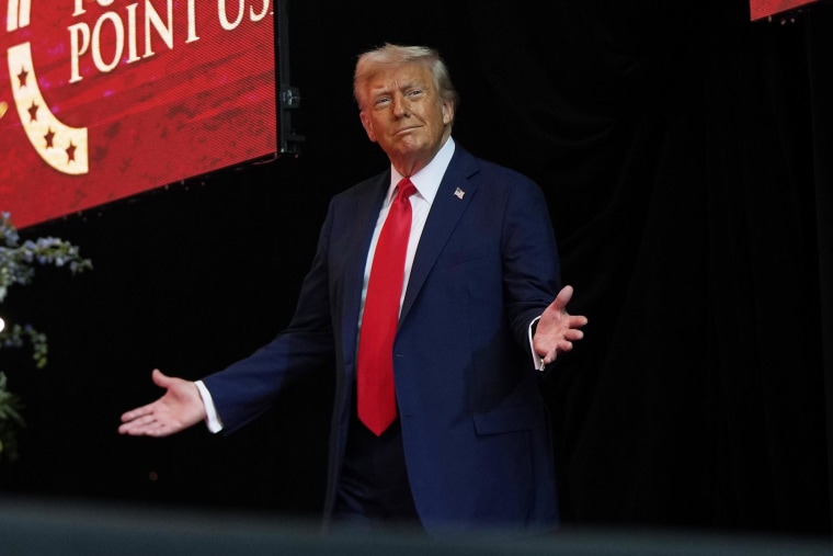 President Donald Trump arrives to speak at a memorial for conservative activist Charlie Kirk