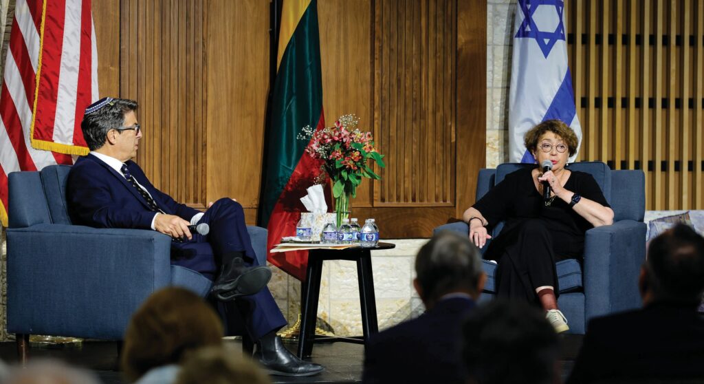 TRADITION—During Valley Outreach Synagogue’s “An Evening of History, Heritage and Diplomacy” session about the country of Lithuania on Sept. 3 in Calabasas, the synagogue’s Rabbi Ron Li-Paz, above left, and Faina Kukliansky, chairperson of the Jewish Community of Lithuania, discuss the history of Jewish people in the Baltic state. Top left, the group Retro performs traditional Lithuanian dances, and at left, Sigute Miller sings a traditional Lithuanian song with passion. The event also featured Lithuanian food, music and history information provided by the country’s Consul General of the Republic of Lithuania in Los Angeles. Photos by MICHAEL COONS/Acorn Newspapers