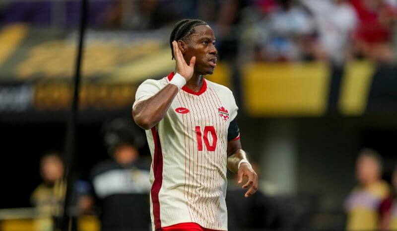 Canada forward Jonathan David (10) celebrates scoring a penalty goal.